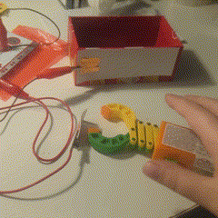 Then I used the crane or clamp to do the Poppy Playtime video game-like interaction, where they use their hands, like cranes, or extend them out to hit the copper tape against each other.